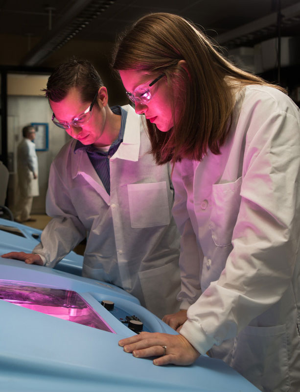 Two researchers working in a lab